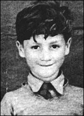 An impish-looking John Lennon during his childhood days in Liverpool, England.