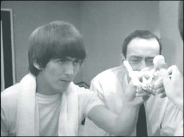 George Harrison in A Hard Day's Night: George shows Shake how to do a good job of shaving in the bathtub scene of the Beatles first film.